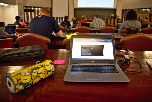 Desk at RSE conf with Minion pencil case